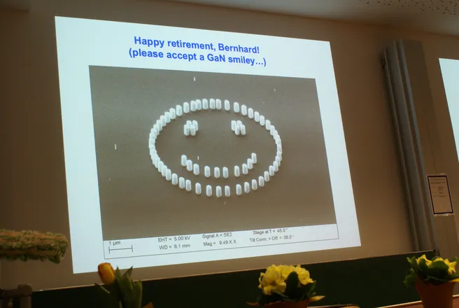 Color photo of a slide presentation showing a smiley face
